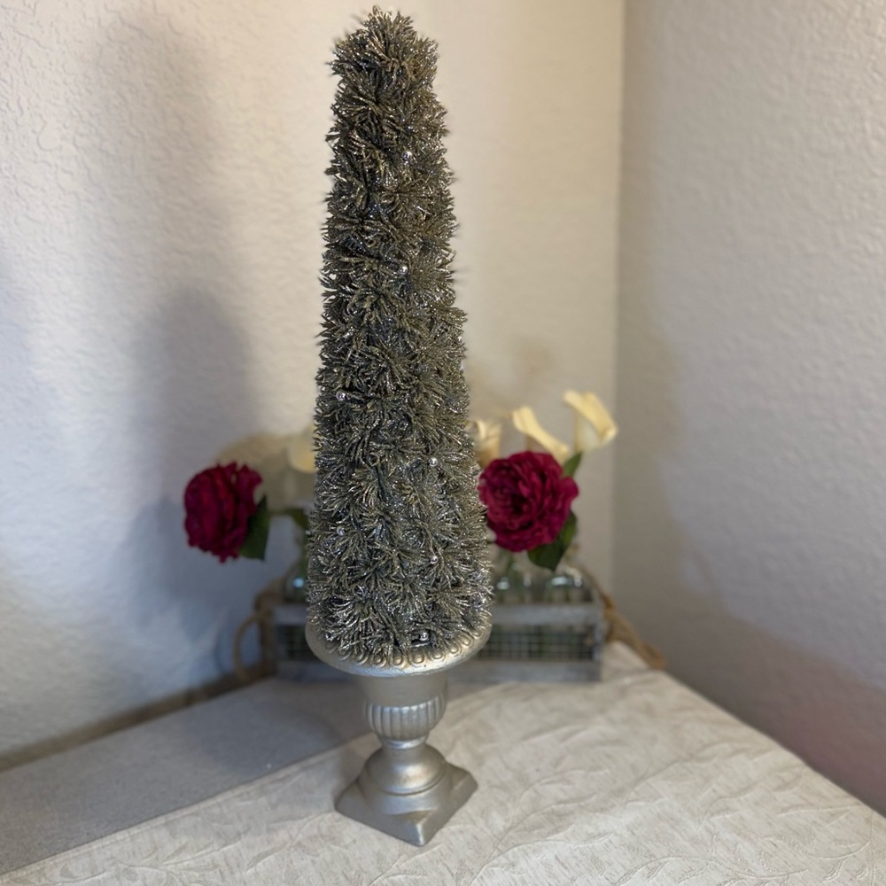 Tabletop‎ Christmas silver tree designed with a sophisticated, vintage look.